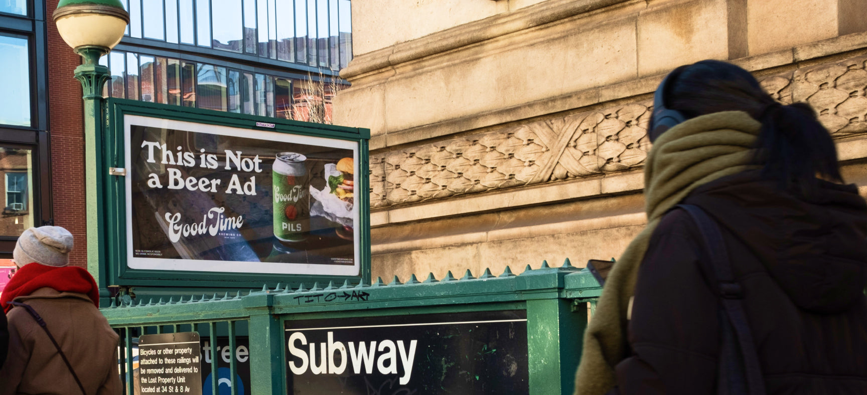 Good Time Brewing's ad for its N/A Pils above a subway entrance in NYC